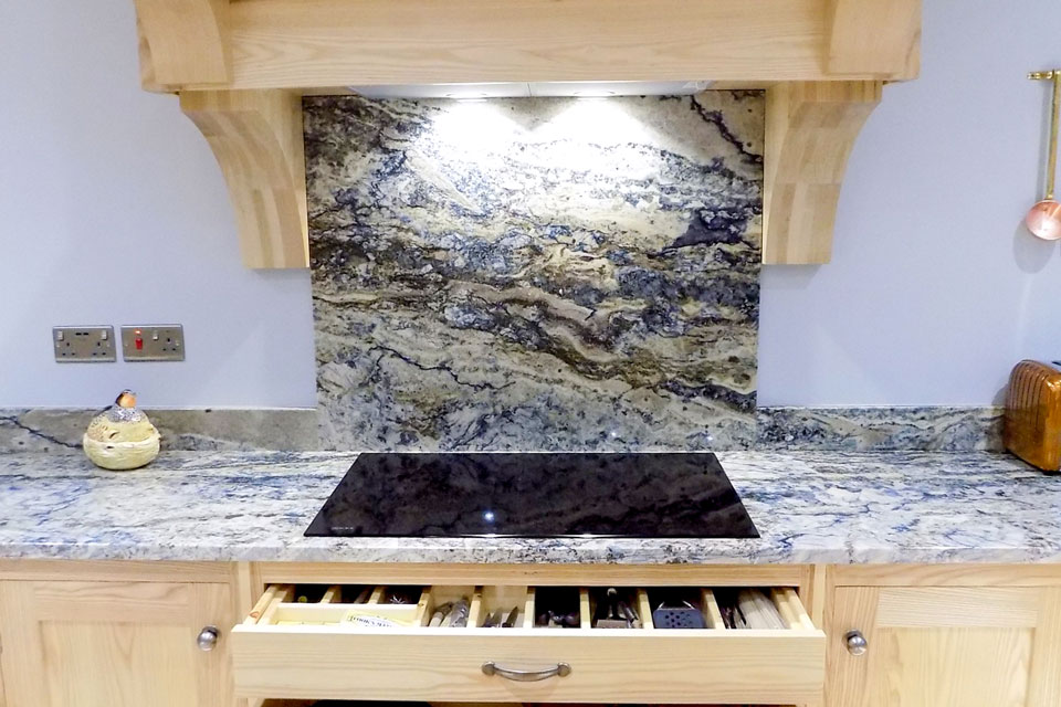 Azzurite Extra Granite (cabinetry by Rose County Interiors)