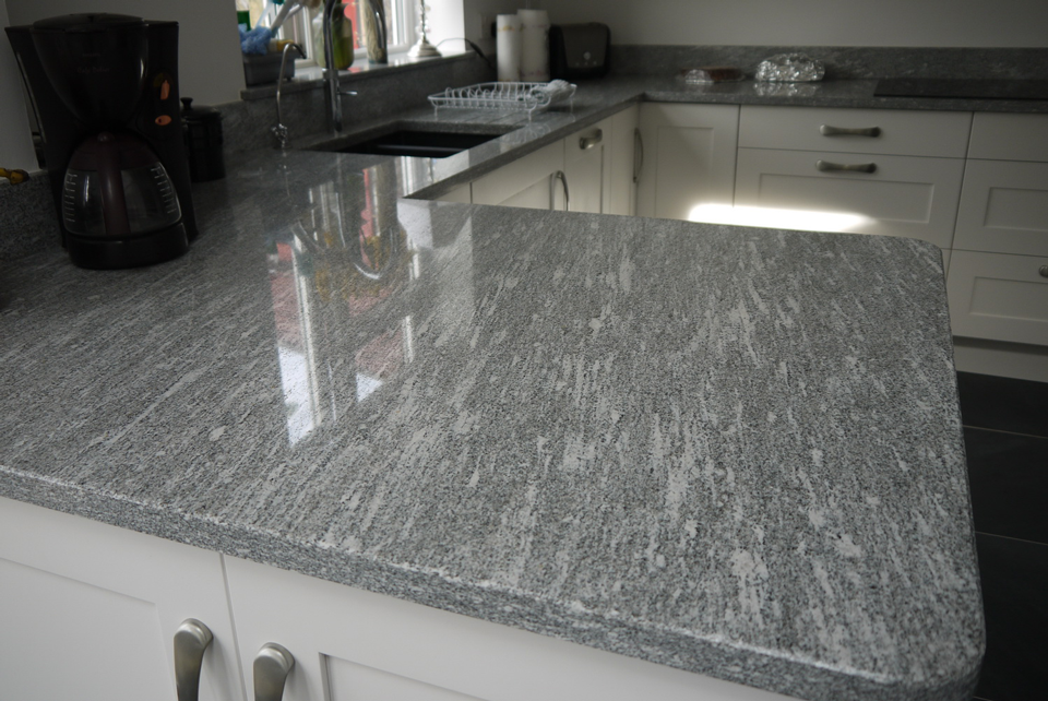 White Storm Granite (cabinetry by Cloisters Design)
